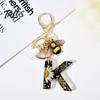 Talos Black Series Keychain Pendant, Dried Flower Initial Letter Charm Key Chain with Bee Tassel Design, A-Z Holder for Bag Purse Backpack