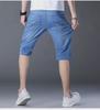 Popular Men's Cropped Four-Season Trousers: Elastic, Mid-Waist, and Trendy 7-Point Regular Denim for Youthful Style