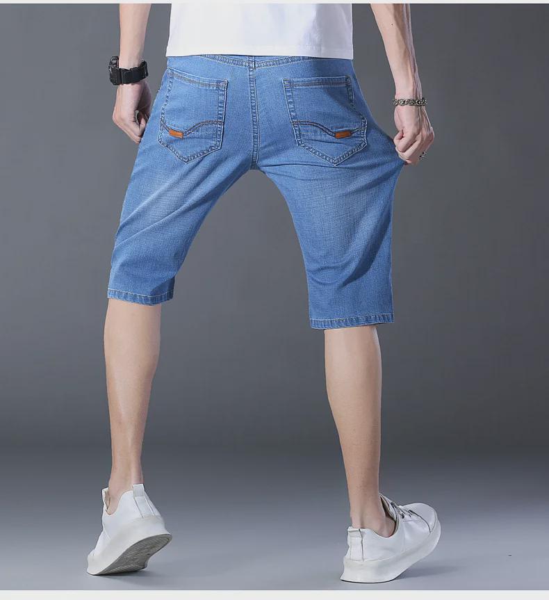 Popular Men's Cropped Four-Season Trousers: Elastic, Mid-Waist, and Trendy 7-Point Regular Denim for Youthful Style