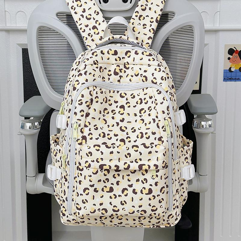 Школьный рюкзак женский студенческий стиль большая вместимость 1011 новый средняя школа старшая школа простой универсальный леопардовый принт милый рюкзак