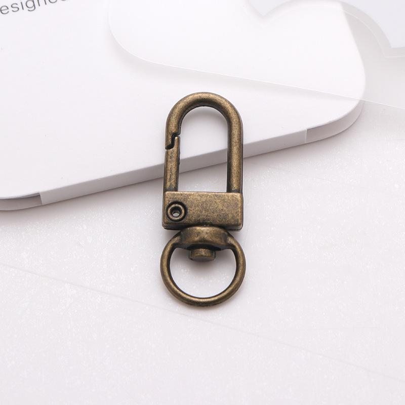 «Вращающийся брелок и крючок для багажа из цинкового сплава — ювелирные изделия и скобяные изделия»