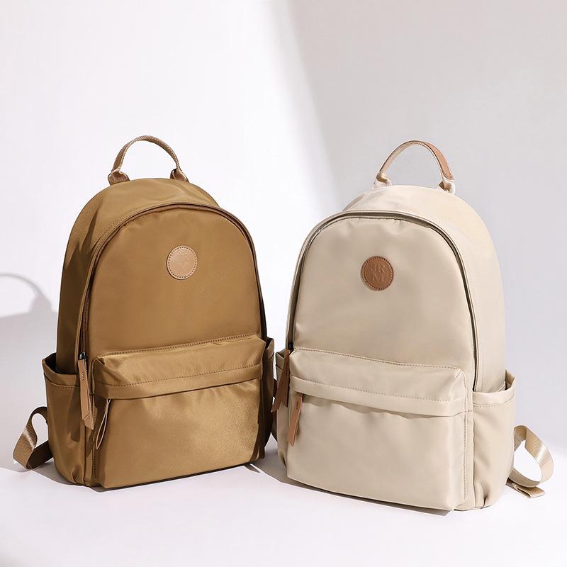 Large Capacity Oxford Cloth Backpack for Women Lightweight and Versatile New Commuting Backpack Korean Version Solid Color Travel Backpack