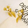 New Stainless Steel Pearl Bow Earrings, a Chic and Unique Design for Women, with a European and American Style