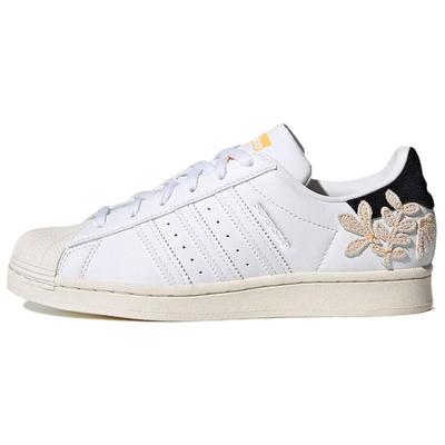 Суперзвезда Цветочные нашивки - Белый Вспышка Оранжевый Женские кроссовки Облачно-белый Основной черный GZ0864