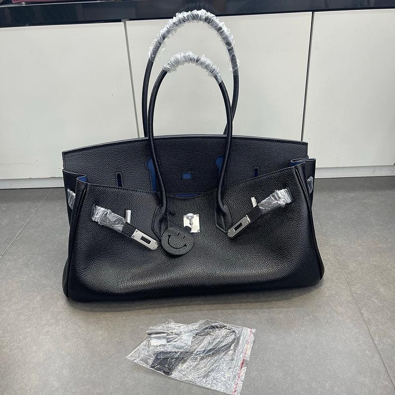 Cross-border trend bag short version oversized portable shoulder bag TOGO first layer cowhide large capacity giant pack