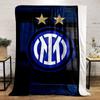 Intertwined white letters in a blue circle, two gold stars above, wood-like background. for all seasons blanket lunch break throw gift
