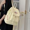 Japanese Student Casual Backpack with Embroidered Puppy Design, Drawstring Closure, and Matching Small Bag for Daily Use.