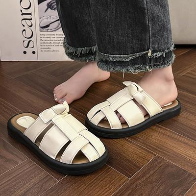 Французские баотоу полушлепанцы женские 2025 лето новые плетеные полые римские плоские черные сандалии с внешней свиной клеткой