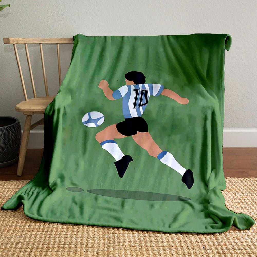 Illustration of a soccer player wearing stripes chasing a ball on a green field. for all seasons blanket lunch break throw gift