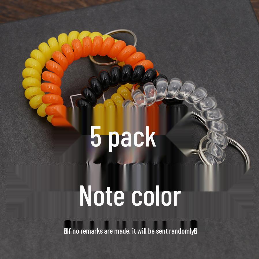 Минималистичный браслет-брелок и резинка для волос в виде пружинного механизма