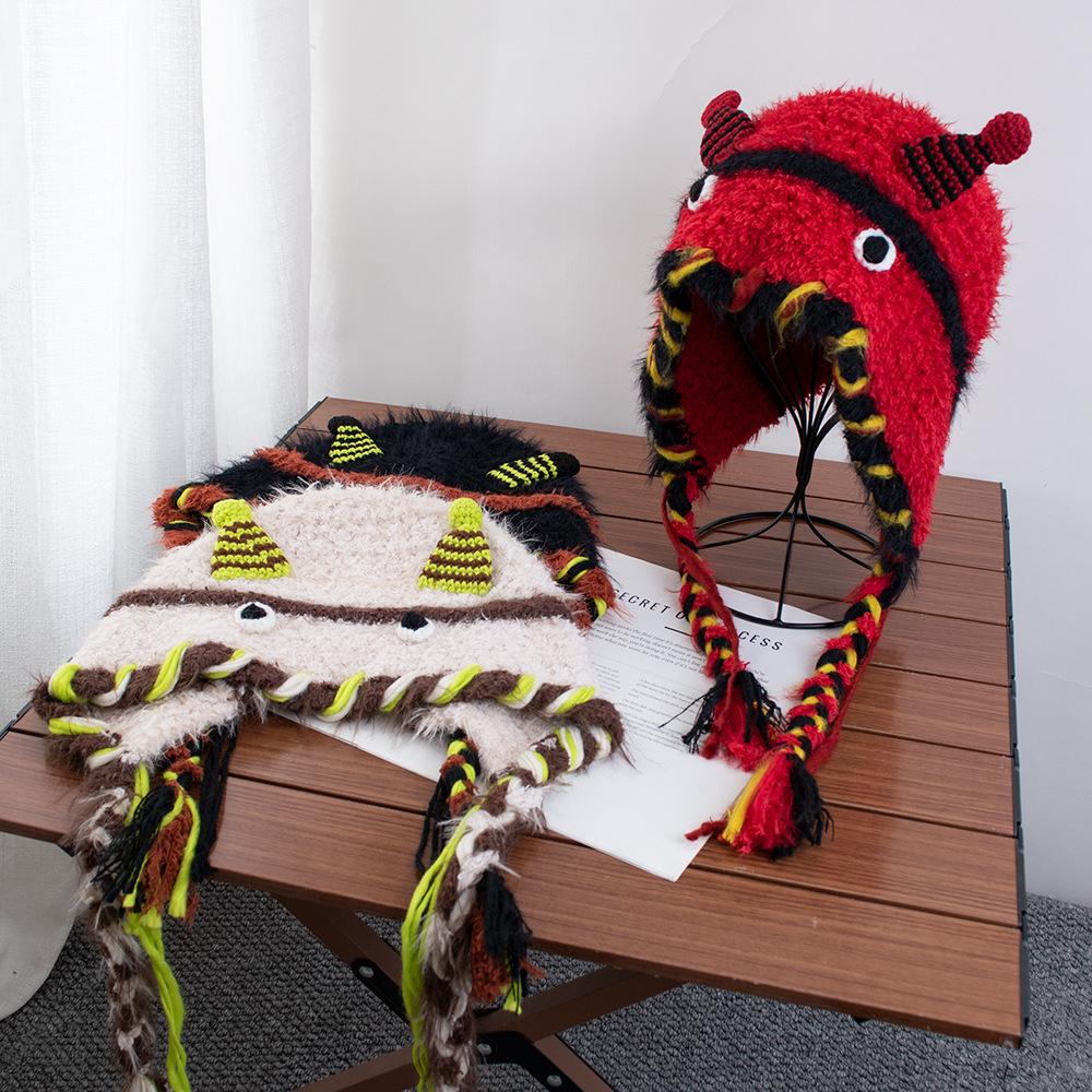 Cartoon little monster woolen hat female autumn and winter fringed braid headgear warm ear protection Lei Feng hat