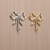A Stylish Golden Rust-resistant Butterfly Hook For Use In Bedrooms, Bathrooms, And Other Places.