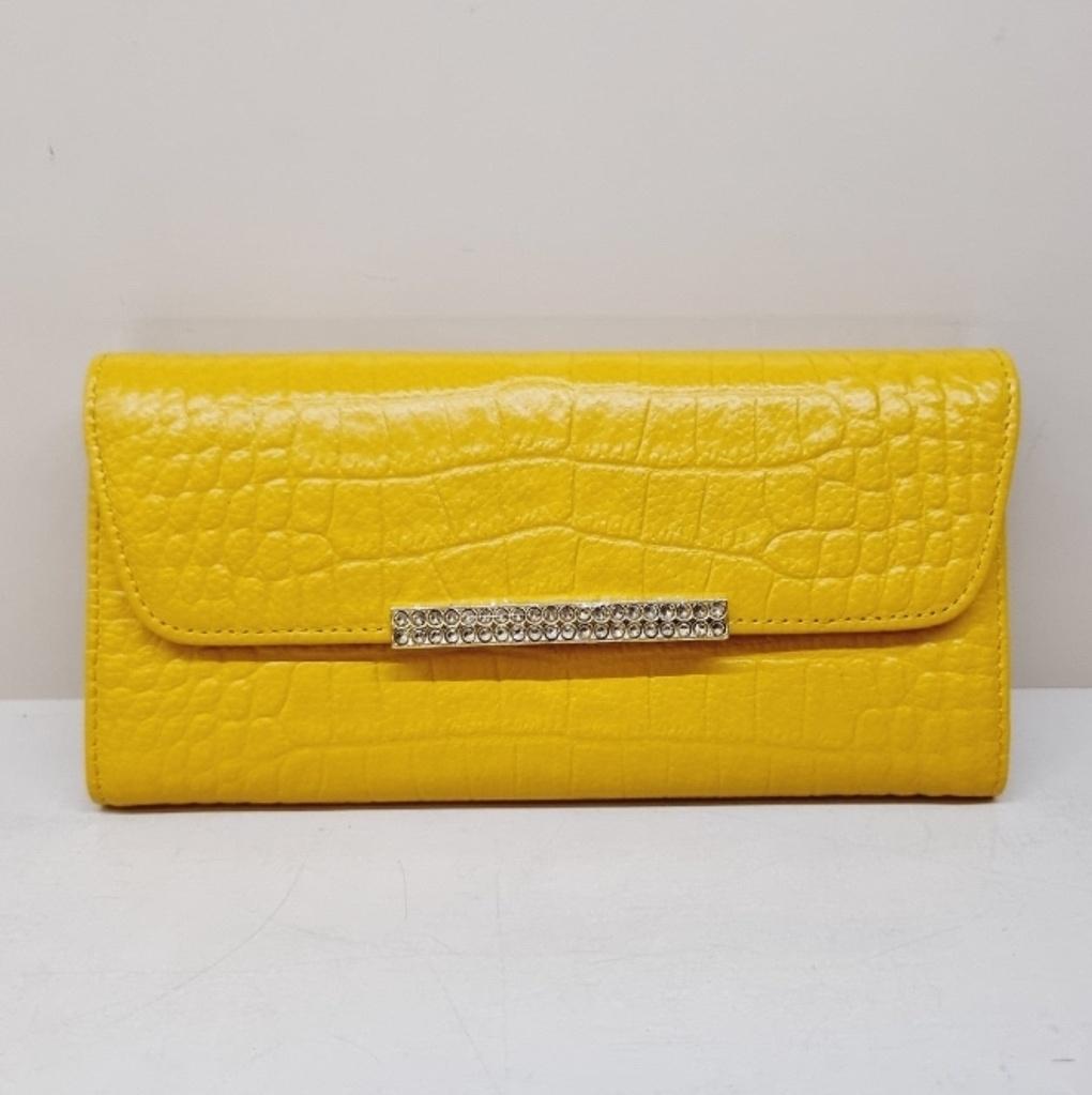 A soft, slim women's long wallet with a subtle pattern.