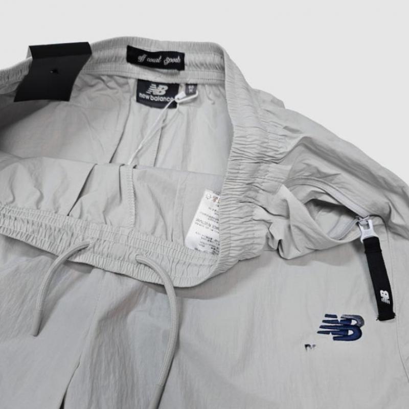 New Balance Унисекс Базовые нейлоновые брюки с логотипом Nbntc32703