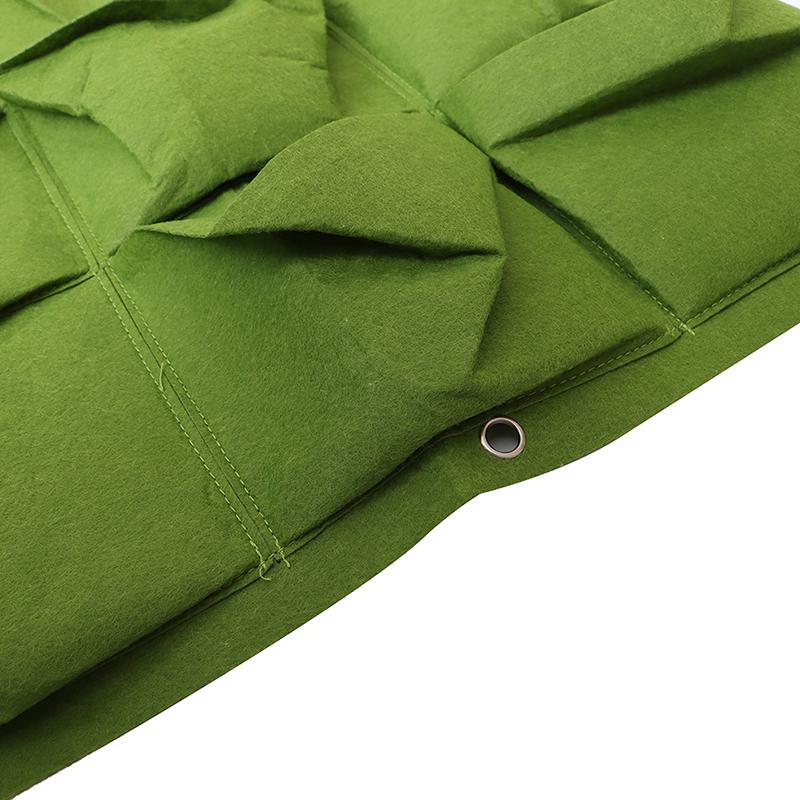 Зеленые вертикальные висячие цветочные горшки садового плантатора кладут в сумку подвес держателя стены