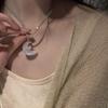 Zen Moonlight Cat's Eye Stone Necklace: Ethereal Fairy Crescent with Braided Rope Clavicle Chain, Ancient Chinese Style.