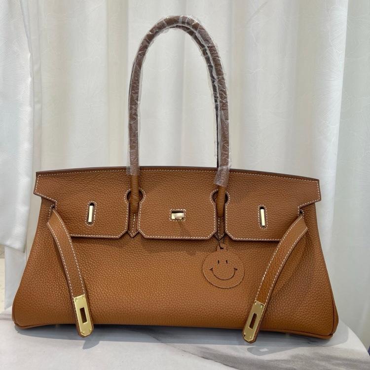 Cross-border trend bag short version oversized portable shoulder bag TOGO first layer cowhide large capacity giant pack