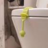 Ручка для подъема сиденья и крышки унитаза