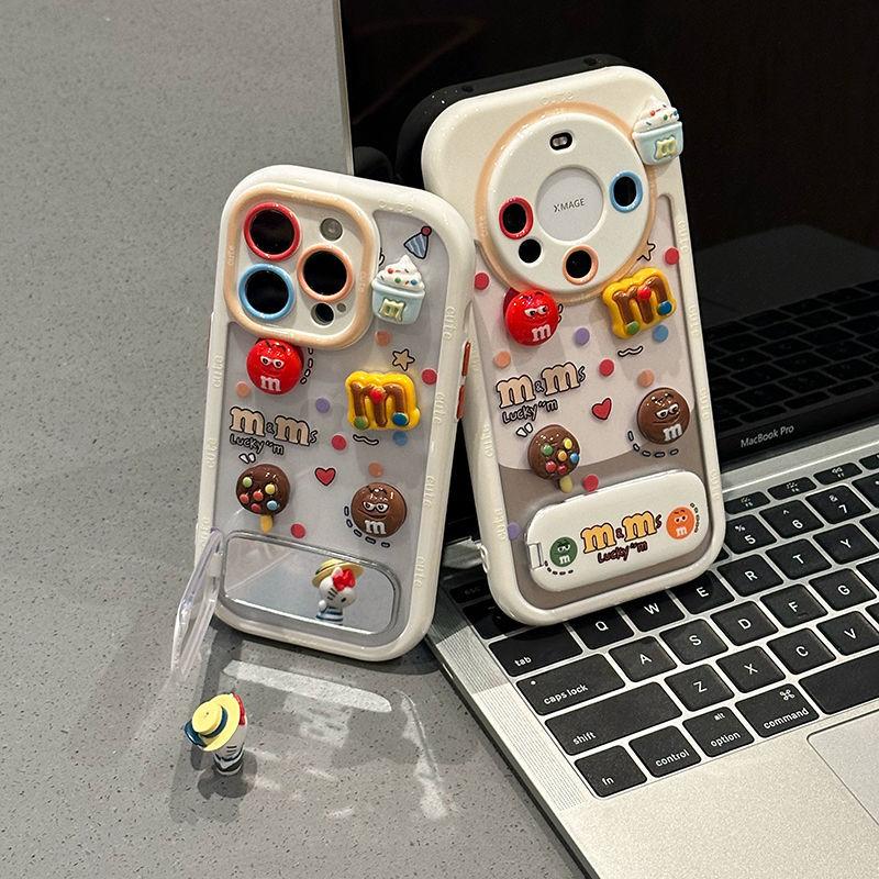 Контрастный цвет Маленькие забавные M&M's Подходит для чехла для мобильного телефона Apple 16 Трехмерный с подставкой Чехол для мобильного телефона iPhone 15 Защита от падений 17