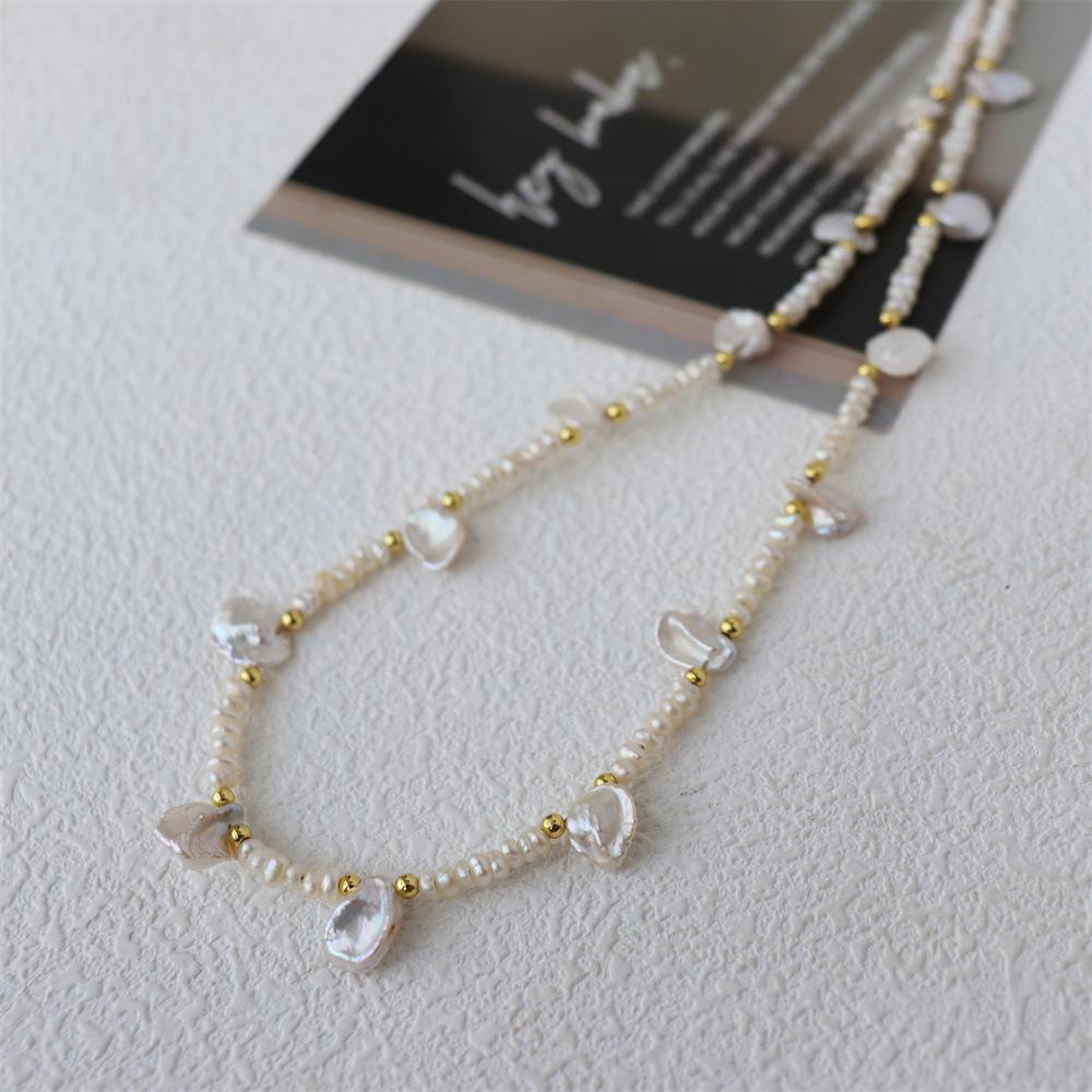 New freshwater pearl necklace for women, featuring natural petal-shaped baroque pearls, an asymmetrical clavicle chain, and a touch of understated