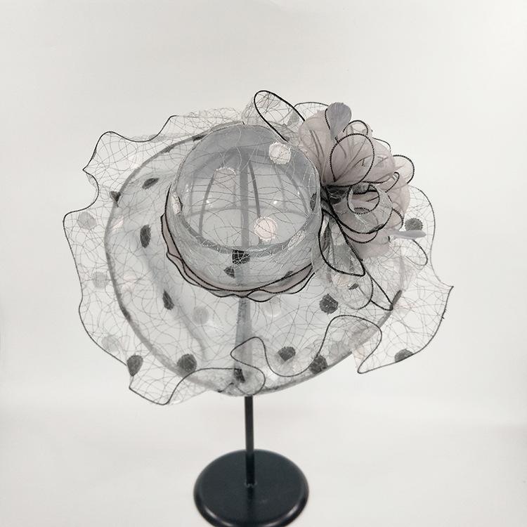 A new summer anti-ultraviolet European and American women's fashion hat, big flower fashion mesh hat, big edge hat.