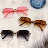 Retro Frameless Sunglasses With Oval Metal Frame And Fashionable Color Tones