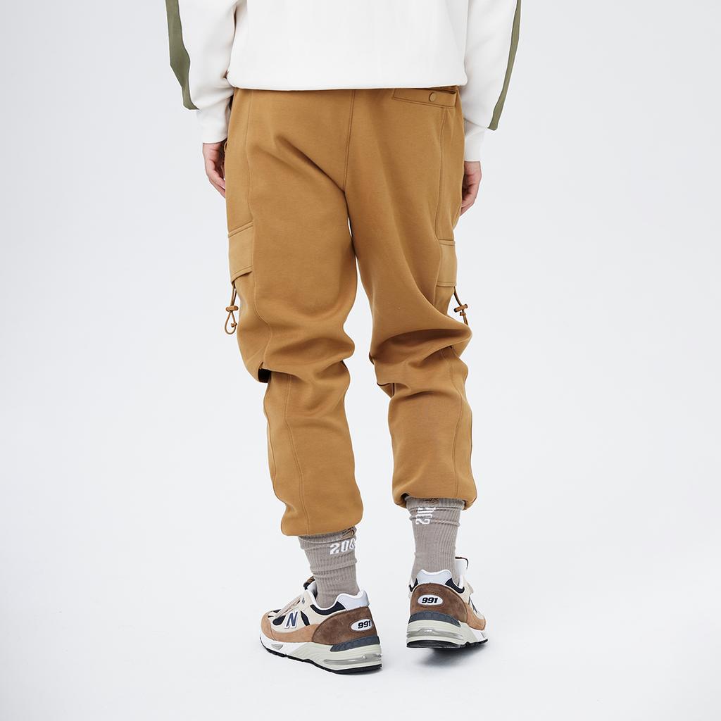 New Balance Штаны осенне-зимние мужские имбирно-желтые AMP14335-THI