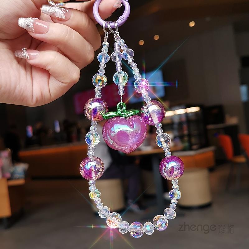 Purple peach pendant, crystal mobile phone lanyard ins women's bracelet, premium wrist pendant, beaded chain short.