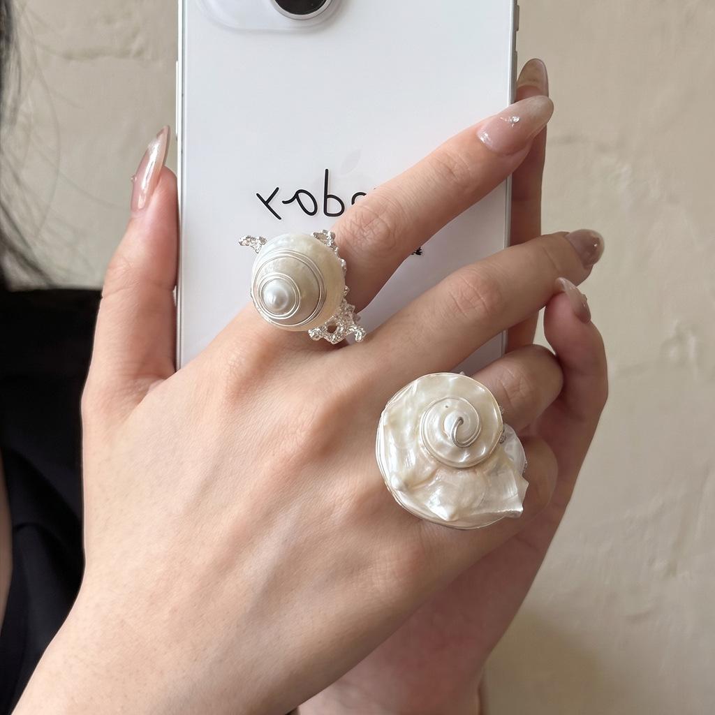 Bohemian-style handmade ring featuring natural seashells High-end, vintage-style ocean-themed oversized conch shell stacking rings