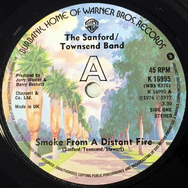Пластинка 7 дюймов SANFORD-TOWNSEND BAND - Smoke From A Distant Fire / Lou K16995 Warner Bros. Re 1977 UK Rock Б/у