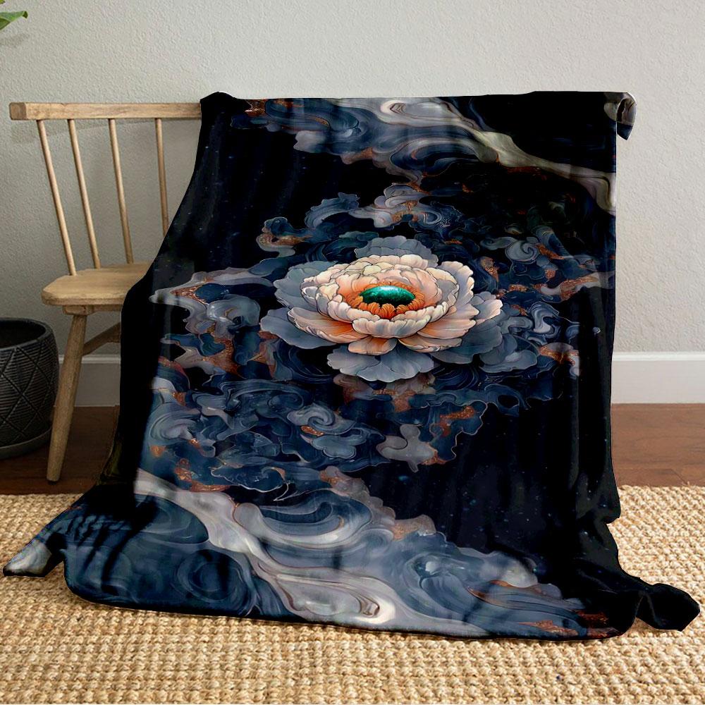 A central flower surrounded by swirling, marble-like dark patterns. for all seasons blanket lunch break throw gift