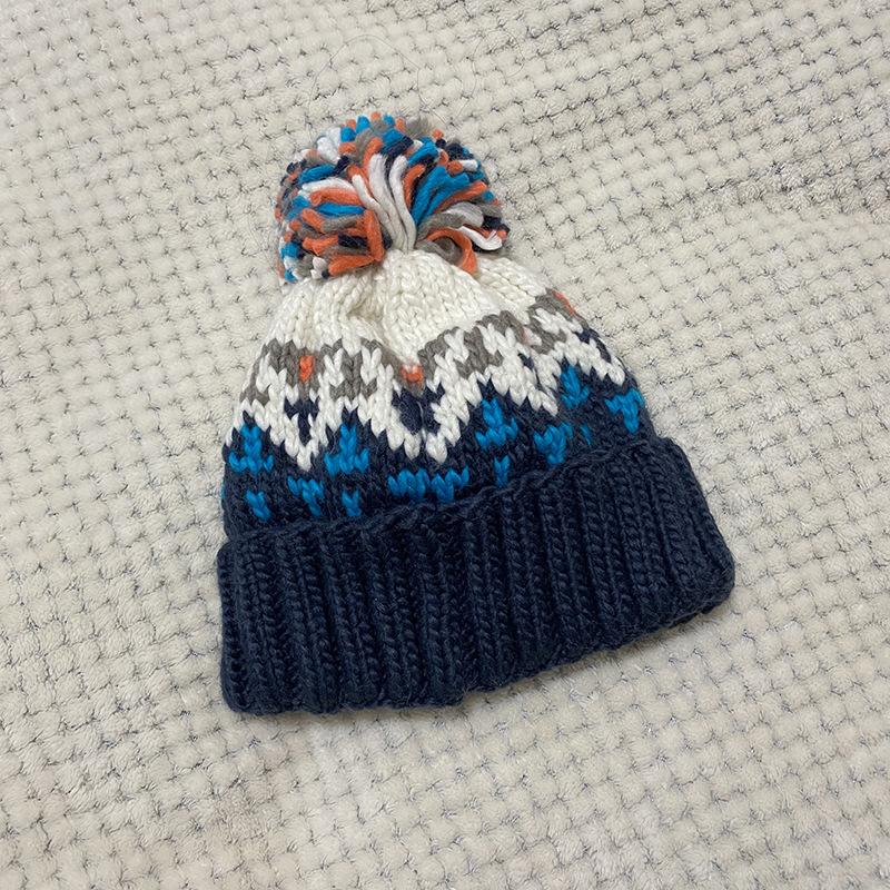 Hat women's autumn and winter warm ear protection wool hat versatile fashion cold hat age reduction cute hairball knitted hat tide