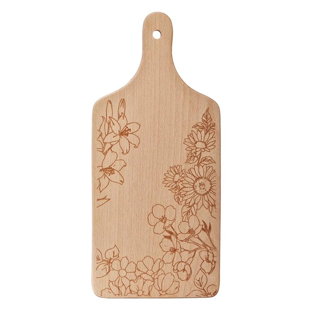 Wooden chopping board with engraved flowers