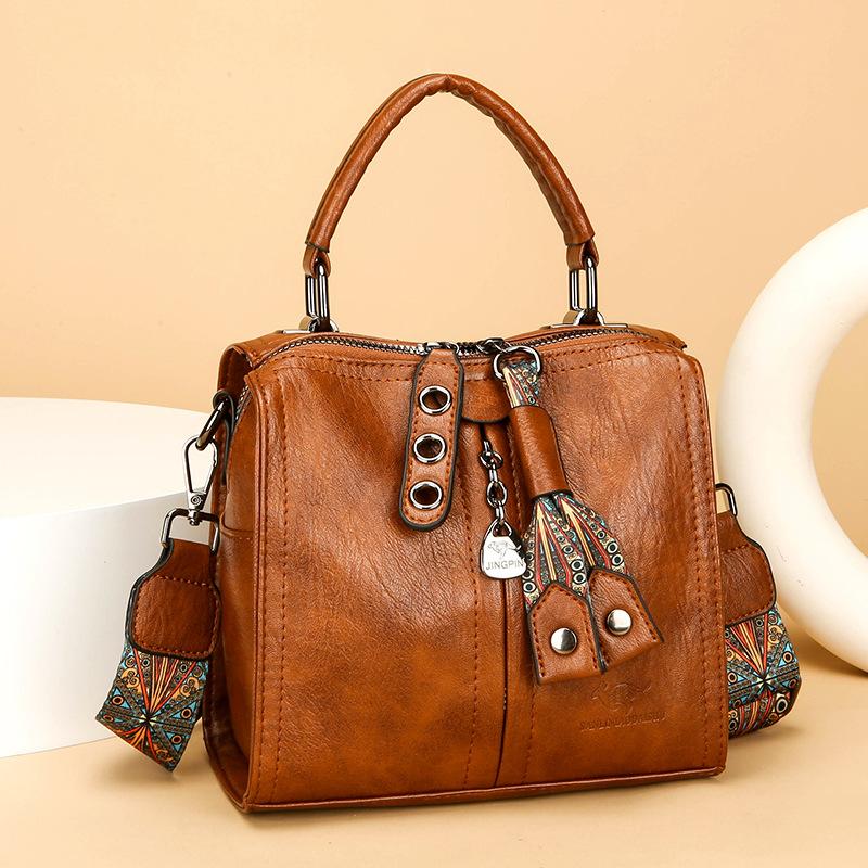 Это высококлассная женская сумочка, одноплечная сумка для поездок на работу и многослойная сумка кроссбоди большой вместимости.