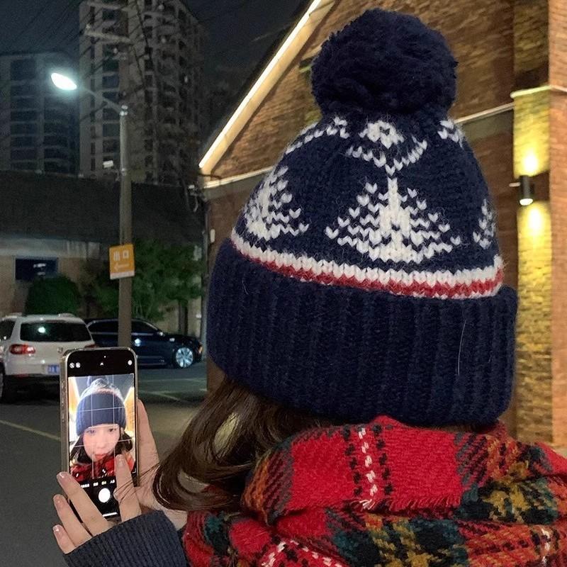 Han Dai winter new Fair Island knitted wool hat retro cute hairball warm thickened ear protector cold hat
