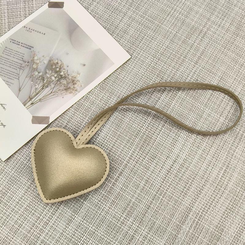 New niche leather peach hand rope pendant simple bag pendant car couple backpack accessories fashion Bag Charm