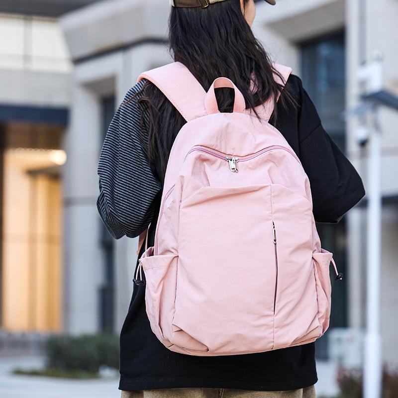 Schoolbag1011 New large-capacity backpack, male and female students schoolbag, multi-functional travel bag, casual and simple commuter bag