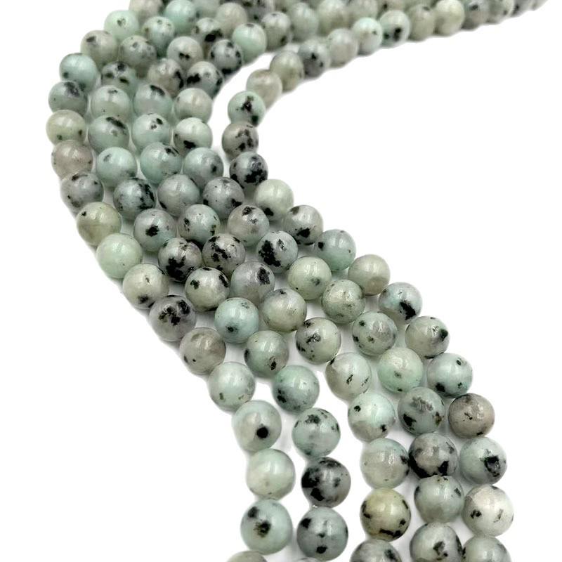 Бусины из натурального камня Тяньшаньский голубой 6-10 мм с черными пятнами для изготовления браслетов своими руками.