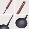 Chinese ladle for wok use, made of iron nitride, rust-resistant, with a wooden handle, heat-resistant, and with a hanging hole for easy grip. Perfect