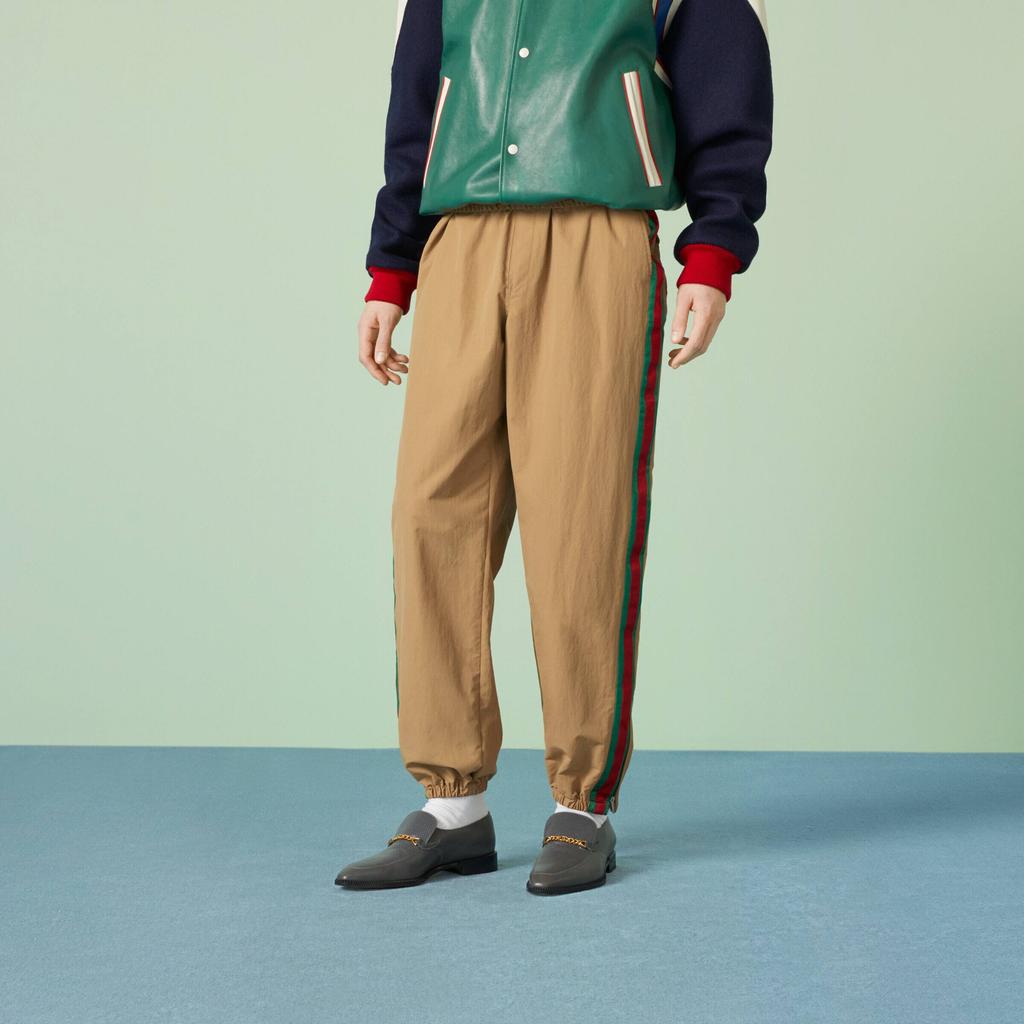 Gucci Зауженные брюки с вышитым логотипом 742772-ZANW8-2371