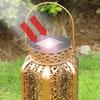 LED solar light with long battery life iron shell with hollowed out retro style waterproof automatic sensing solar light