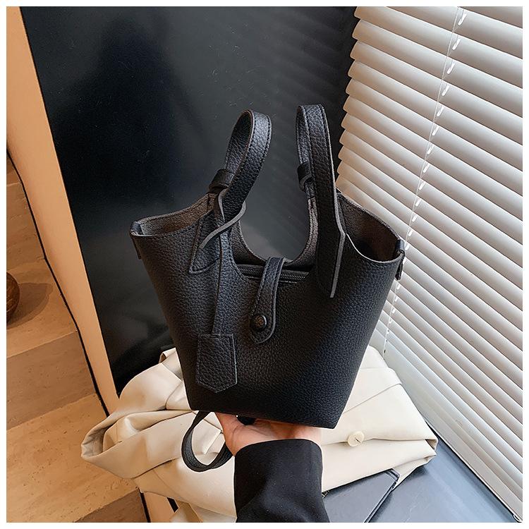 Оптовая продажа 2025 новая нишевая сумка-тоут с узором личи, женская корейская версия, простая сумка-ведро, повседневная сумка-мессенджер