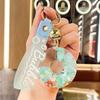 Luminous Oil-Filled Donut Quicksand Keychain: Exquisite Car Pendant & Bag Accessory, Ideal for Gifts.