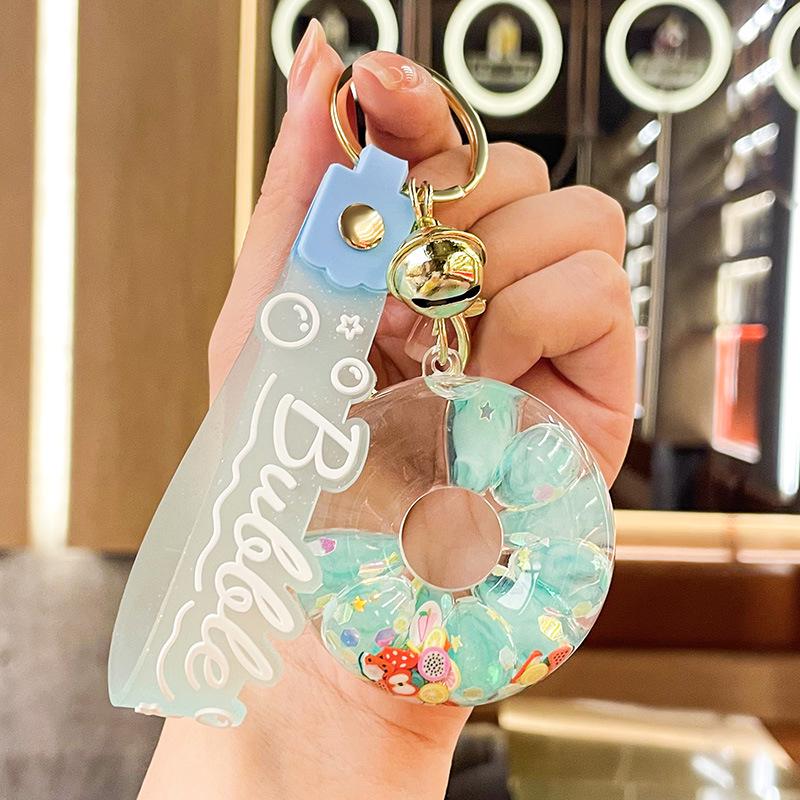 Luminous Oil-Filled Donut Quicksand Keychain: Exquisite Car Pendant & Bag Accessory, Ideal for Gifts.