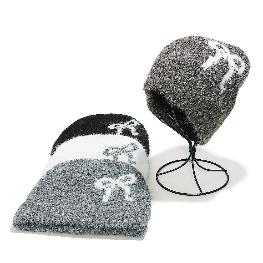 Baotou hat female Korean version bow knitted hat autumn and winter face small cashmere wool hat warm ear protector cold hat children