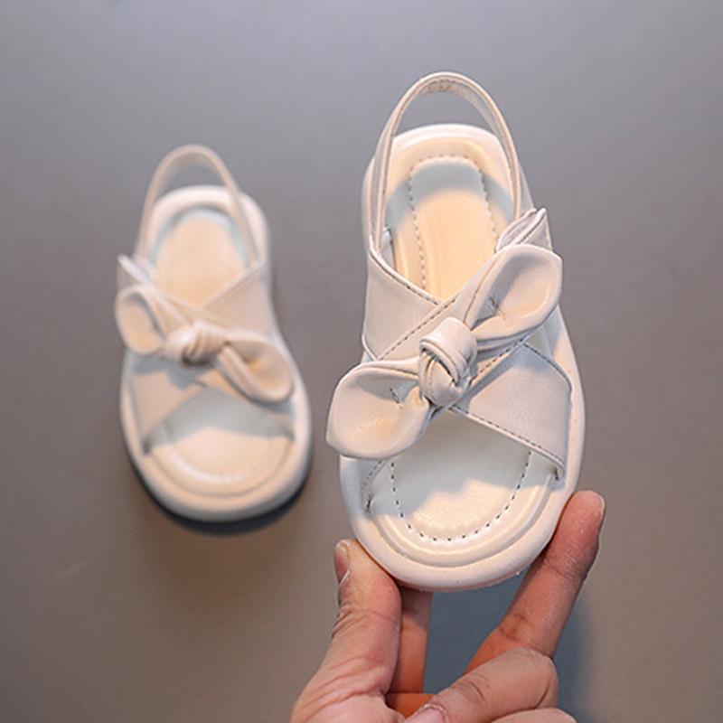 Летние сандалии для маленьких девочек, однотонные модные пляжные сандалии, детская обувь принцессы, мягкие сандалии на плоской подошве с бантом для маленьких девочек