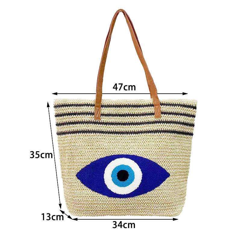 Ecofriendly Straw Shoulder Bag With Blue Eyes Embroidered Design For Summer Outings