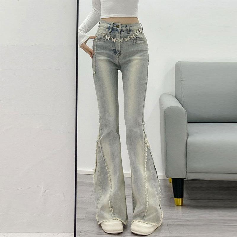 Year design Rough edge American Spice Girl micro-pull jeans women's autumn and winter retro slim slim long pants