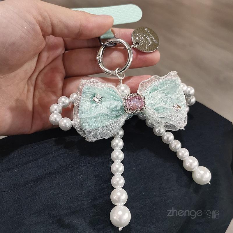 Mesh bow pearl bracelet women's ins fashion Xiaoxiangfeng mobile phone pendant mobile phone lanyard short wrist