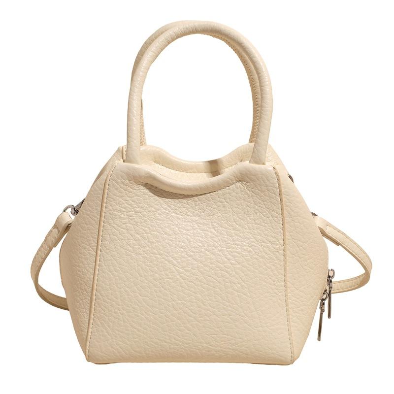 Оптовая мода высокое чувство простой стиль однотонный узор личи сумка-ведро повседневная универсальная сумка-мессенджер для通勤 для женщин